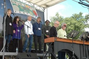 Prana performs with members of NEXUS, Russell Hartenberger and Garry Kvistad, during the opening ceremony.